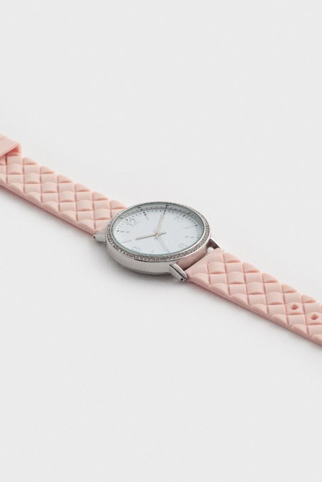 An example of a standard product shot; one of the simplest types of product photography. This example shows a watch photographed at an angle on a plain background.